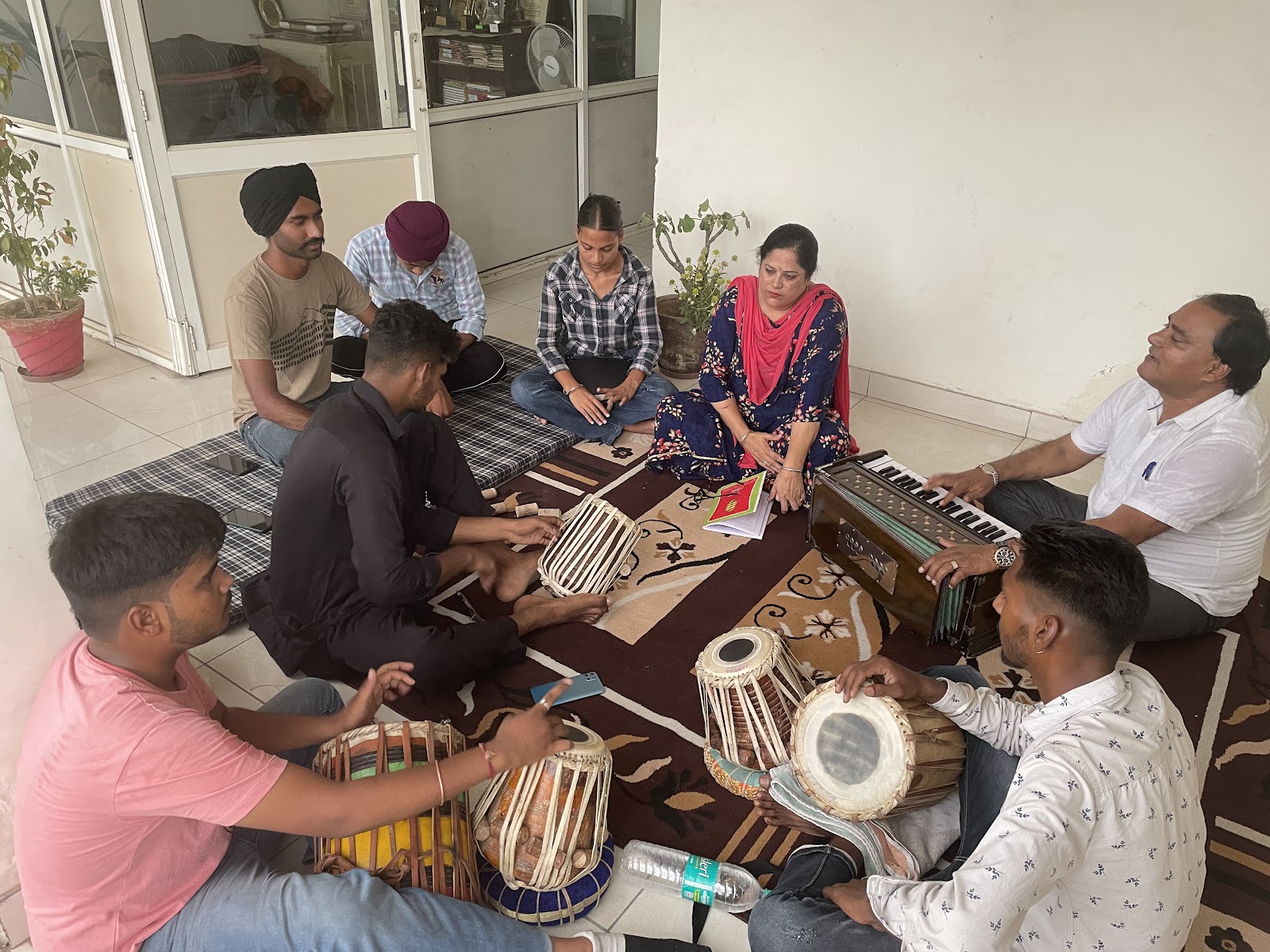 Students practising tabla and harmonium together at Sur Sangeet Academy